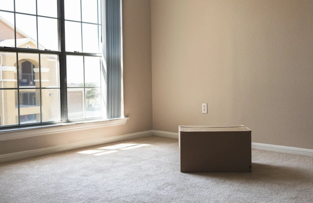 A moving box in a carpeted home