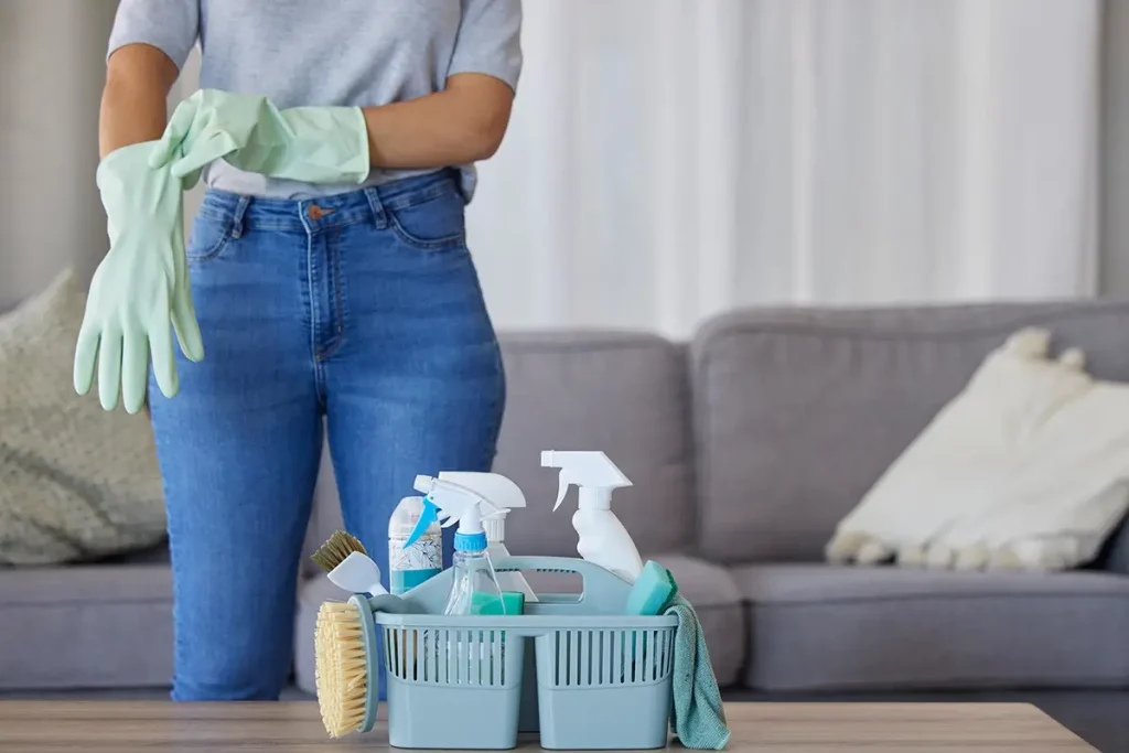 Woman in living room getting ready to clean house